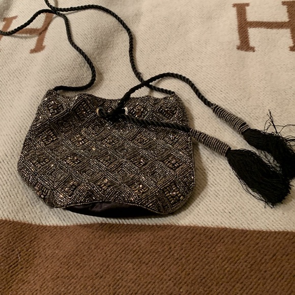 Beaded and jeweled bag with ties Long strap/cord.
Great bag Very decorative - Picture 3 of 6